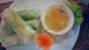 Delicate spring rolls with mint and rice noodles, served with a dip